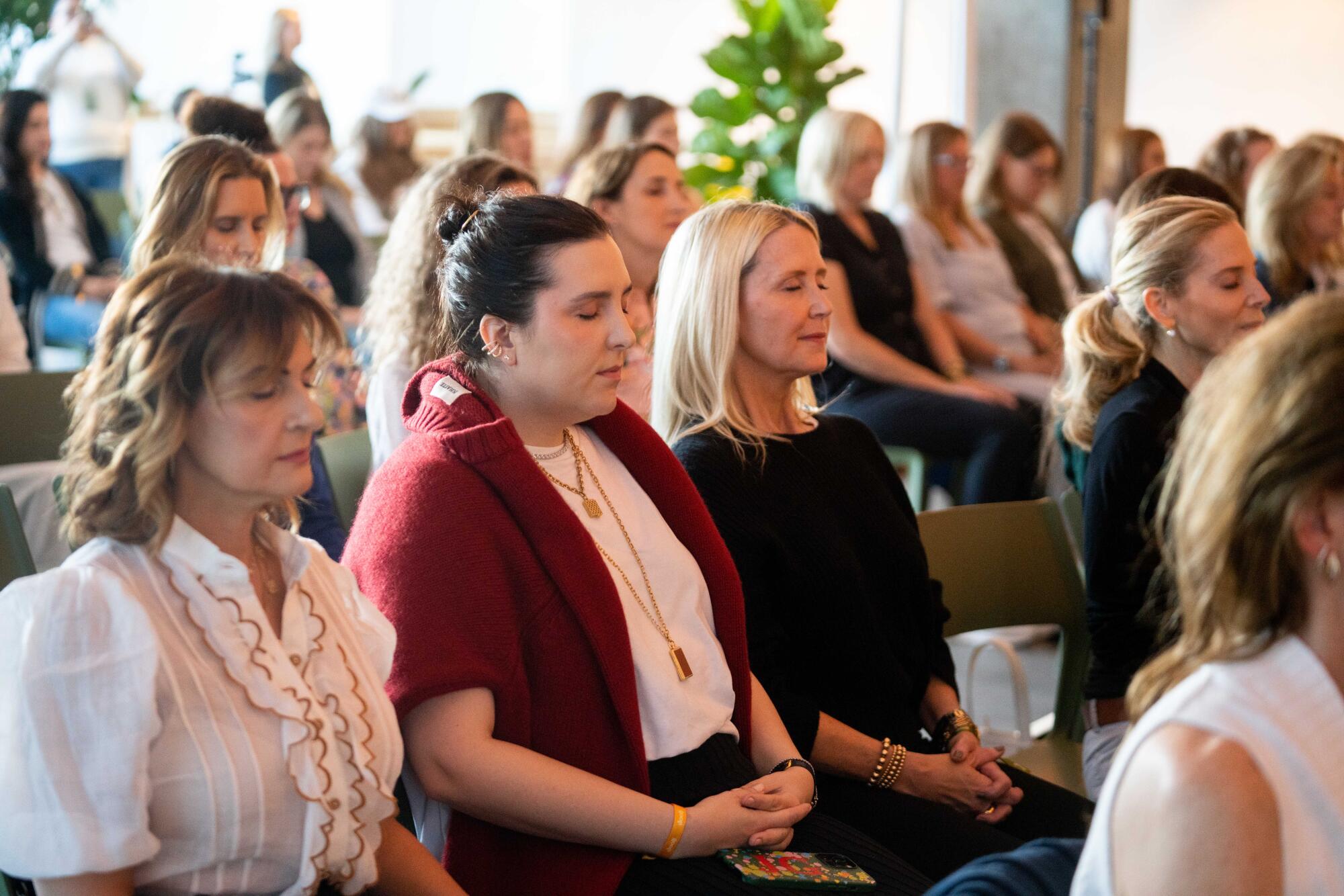 The crowd meditates at the Goop Immersive event in Santa Monica.