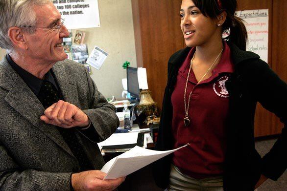 Phil Holmes, 66, makes a point about an essay by Josalyn Burns. Holmes offered View Park Preparatory a gold standard of teaching. If a View Park student got an A from him, the principal figured, it would mean they were ready to compete with the best of the best.