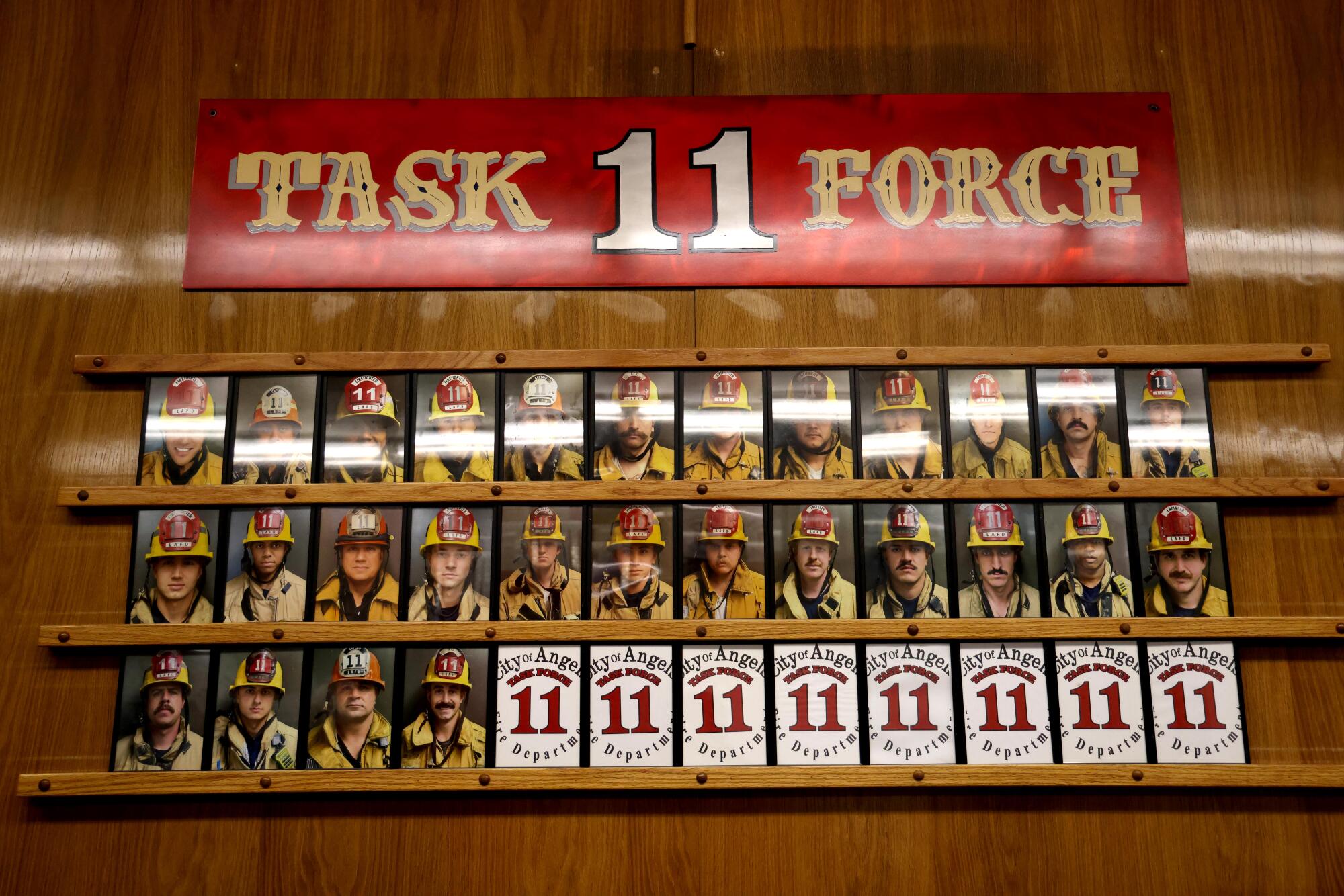 A display of head shots of firefighters in uniform.