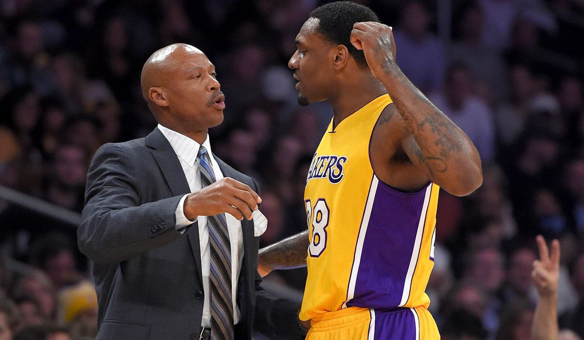 Lakers Coach Byron Scott talks with forward Tarik Black during the second half of their 101-84 victory over the Orlando Magic on Friday night at Staples Center.