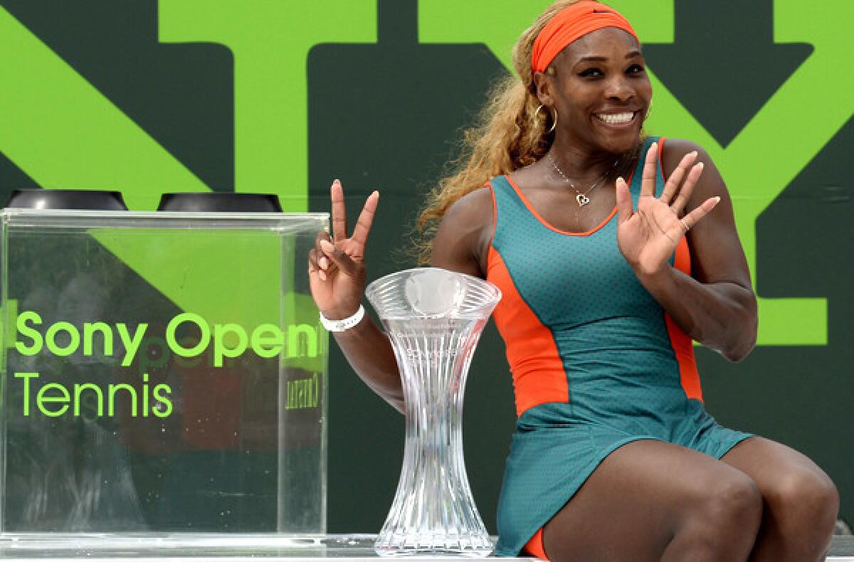 Serena Williams poses with the Sony Open trophy after defeating Li Na in the women's championship match on Saturday in Key Biscayne, Fla.