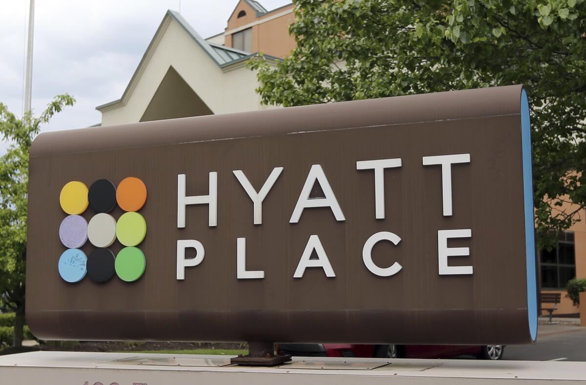 FILE - A Hyatt Place hotel sign marks its location on May 4, 2017 in Carnberry, Pa., Butler County. Hyatt Hotels says it will buy resort-management company Apple Leisure Group from two private equity firms for $2.7 billion. (AP Photo/Keith Srakocic)