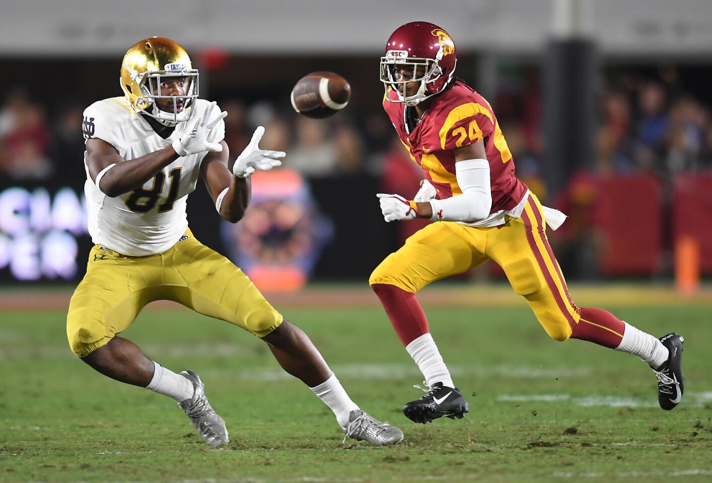 Notre Dame tight end Miles Boykin makes a catch in front of USC cornerback Isaiah Langley in the second quarter at the Coliseum.