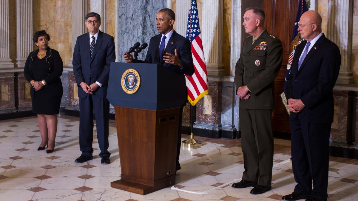 President Obama speaks on the Orlando shooting while Attorney General Loretta Lynch, Treasury Secretary Jack Lew, Chairman of the Joint Chiefs of Staff General Joseph Dunford and Director of National Intelligence James Clapper stand at his side.