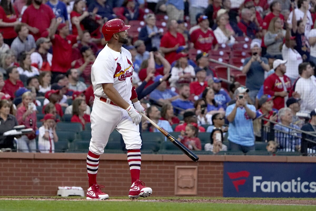 St. Louis Cardinals' Albert Pujols watches his solo home run during the first inning of a baseball game against the Kansas City Royals Tuesday, April 12, 2022, in St. Louis. (AP Photo/Jeff Roberson)