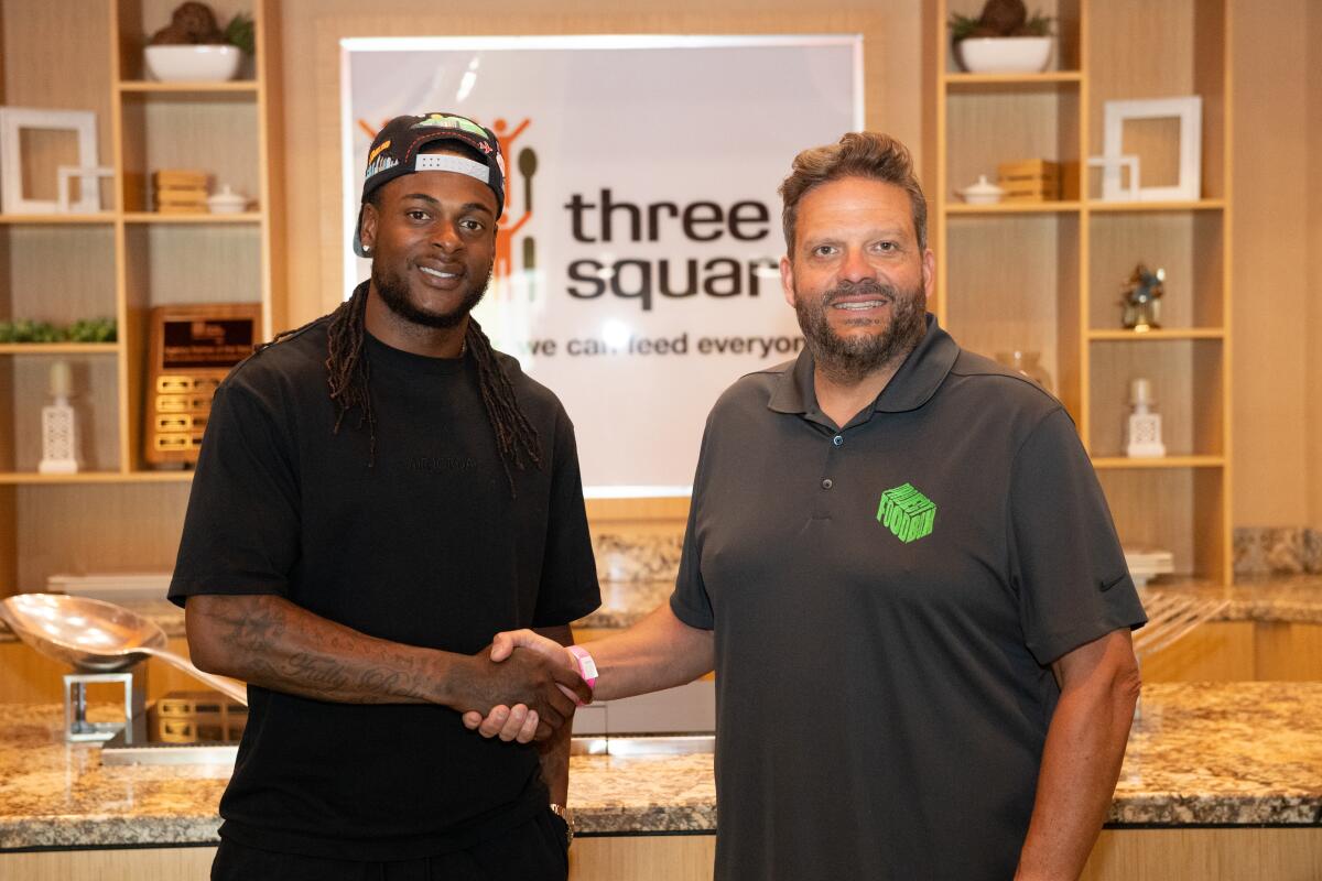 Receiver Davante Adams visits Three Squares Food Bank in Las Vegas with Steve Brazeel, founder of Project FoodBox. 