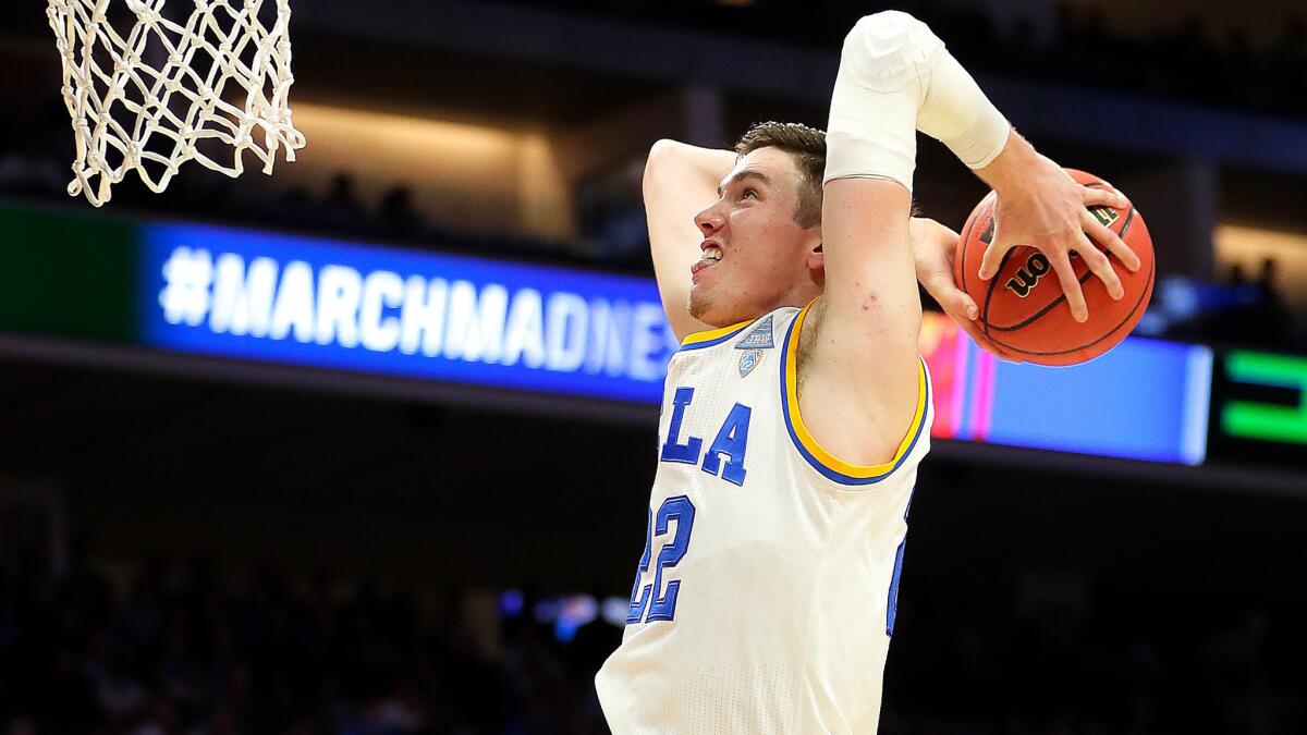 UCLA forward TJ Leaf goes up for a dunk against Kent State on March 17.