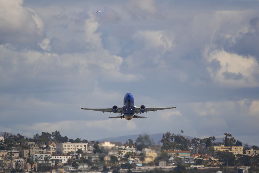 A commercial passenger airliner takes off from San Diego International Airport.