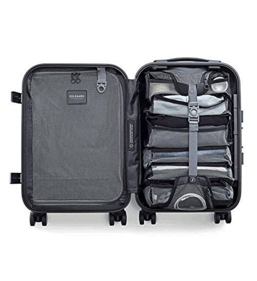 The Carry-On Closet 2.0 is a lightweight, wheel-aboard bag with a six-tier shelving unit that compresses into the suitcase.