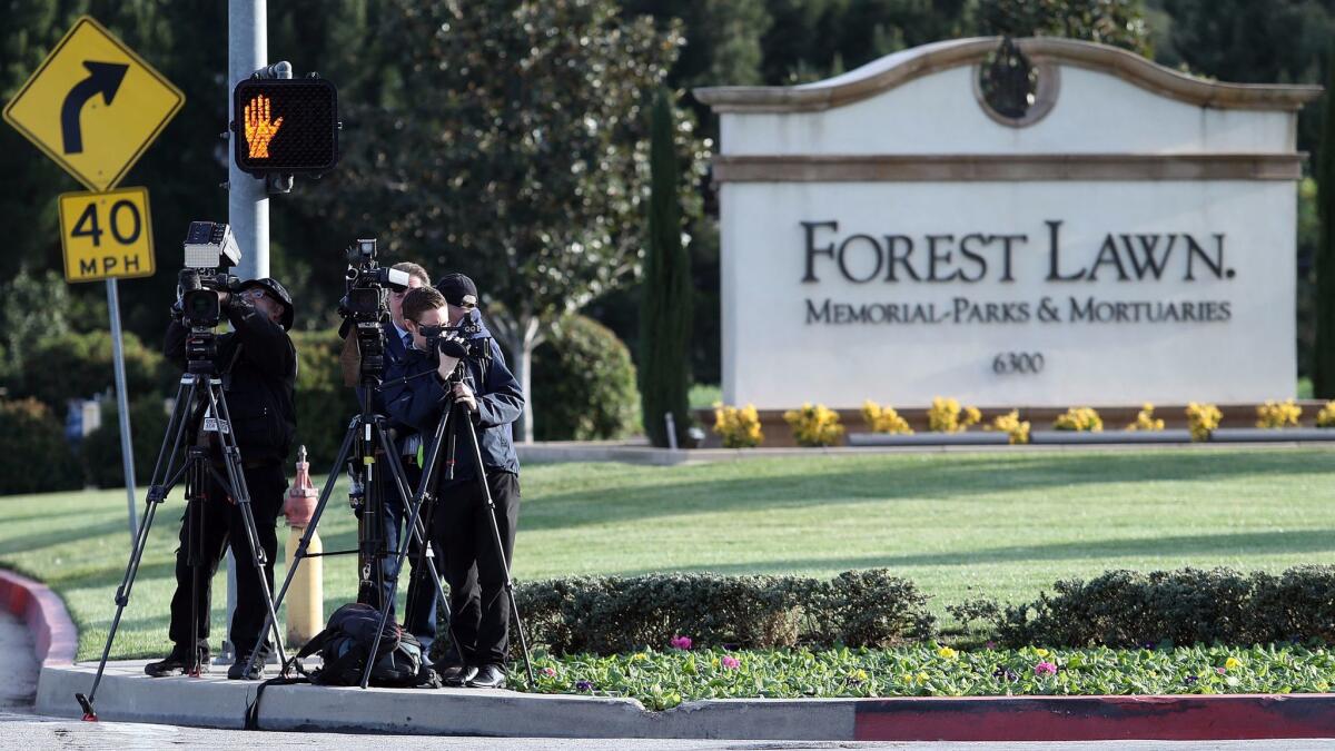 News crews await the arrival of the Carrie Fisher-Debbie Reynolds funeral procession at Forest Lawn -- Hollywood Hills in Los Angeles on Jan. 6, 2017. (Frederick M. Brown / Getty Images)