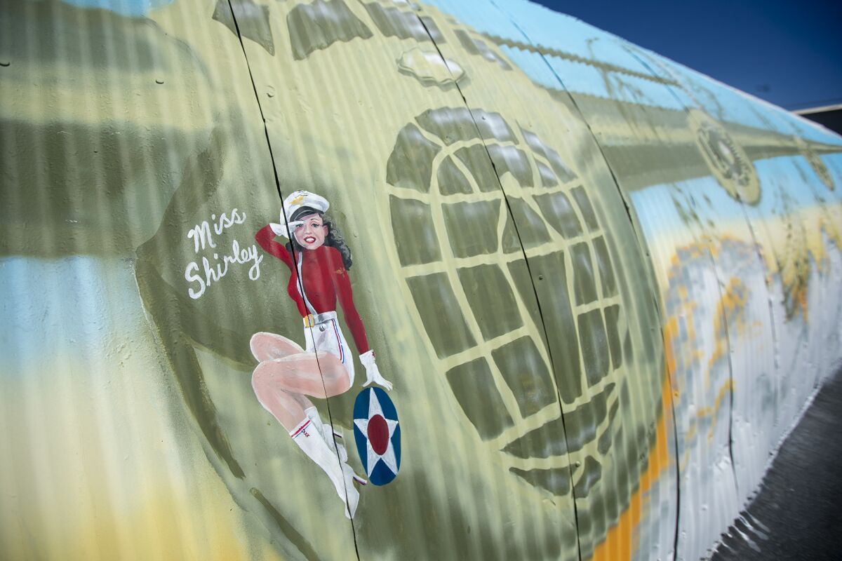 Artist Nancy Hadley, who painted a B-24 Liberator on the side of a Quonset hut, put her mom, Shirley Walker, in the mural.