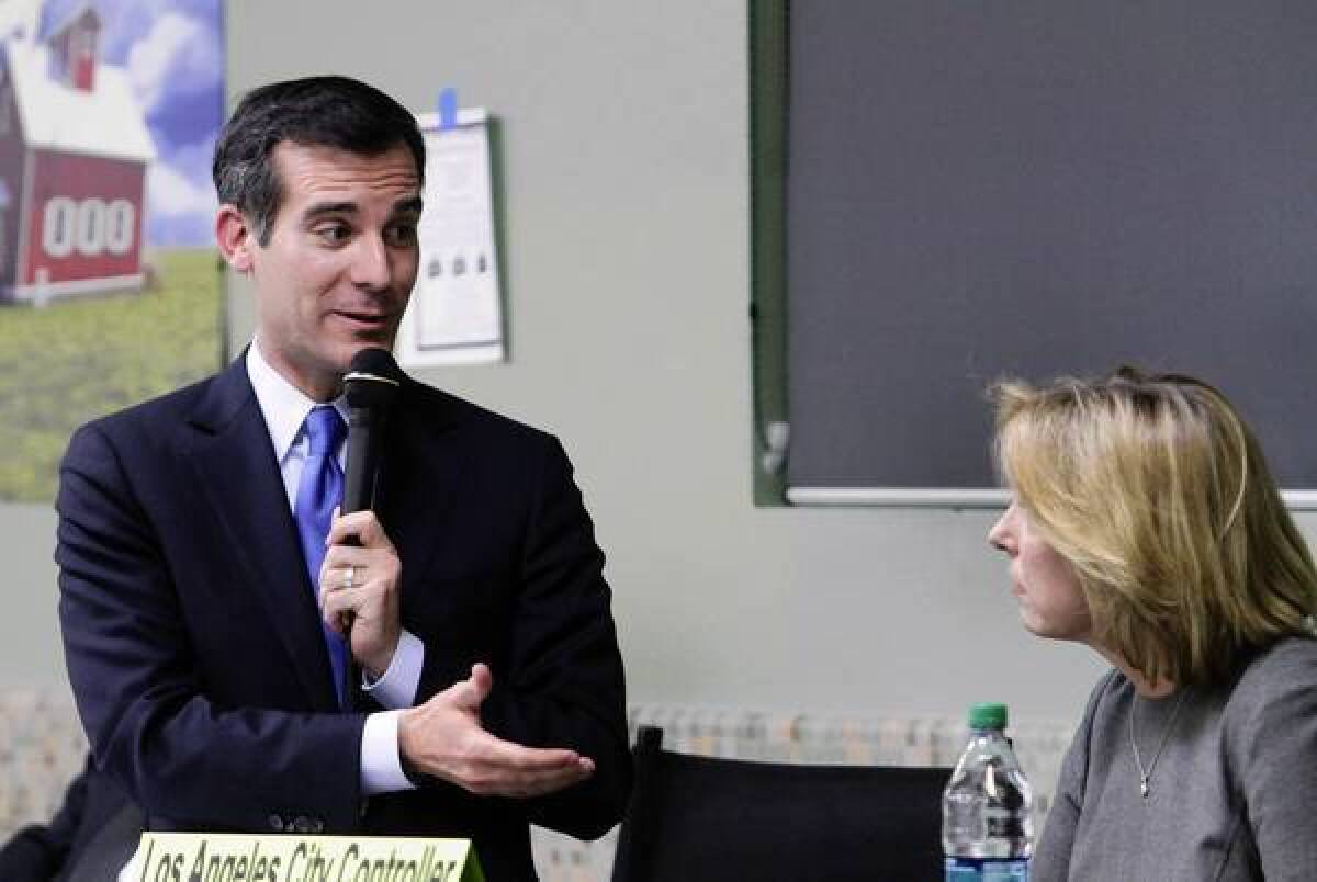 Eric Garcetti and Wendy Greuel trade barbs in Wednesday night's debate at Notre Dame High School in Sherman Oaks. The event was sponsored by the Sherman Oaks Homeowners Assn.