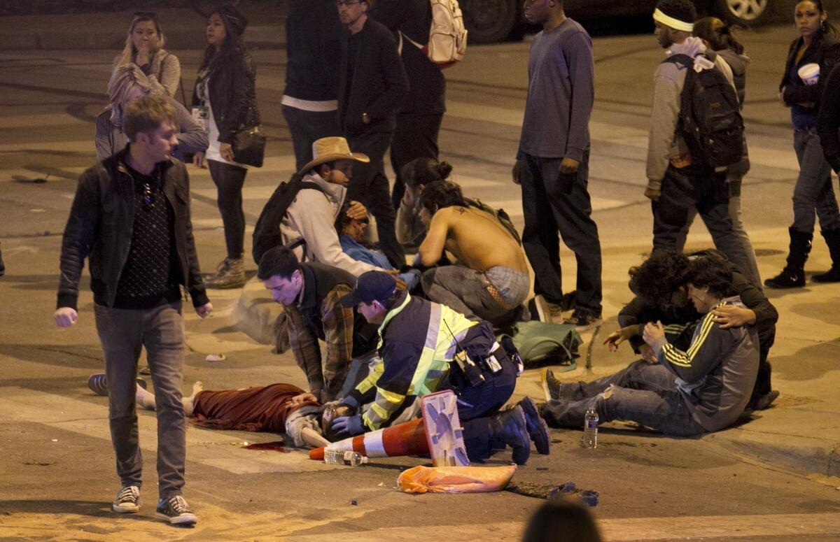 People are treated after being struck by a vehicle on Red River Street in downtown Austin, Texas, during SXSW.