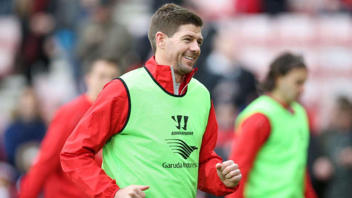 Liverpool midfielder Steve Gerrard smiles while warming up before an English Premier League match against Sunderland on Saturday.