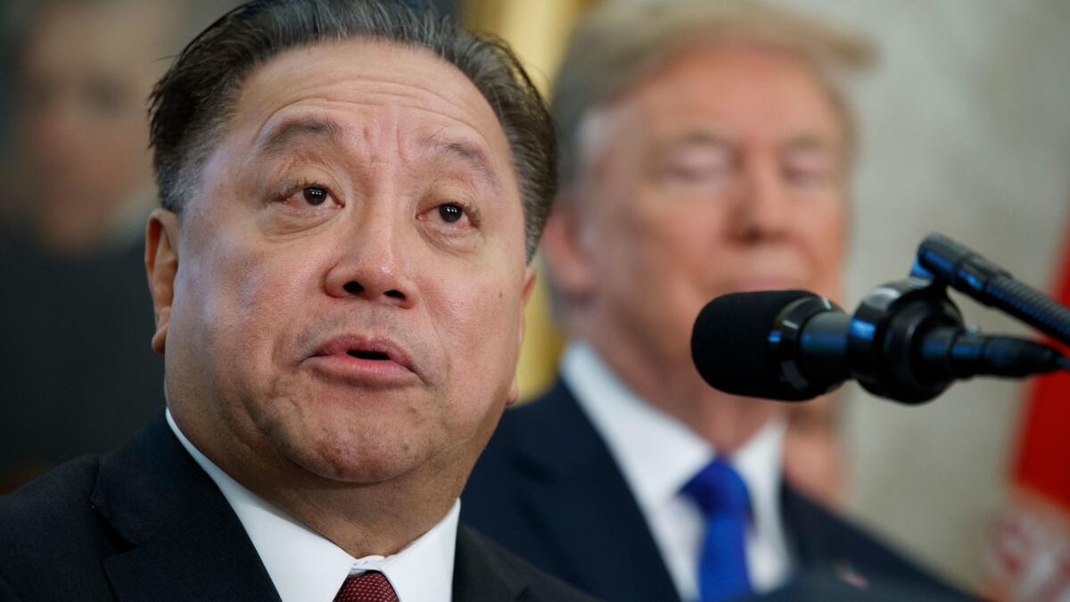 Broadcom Chief Executive Hock Tan appears with President Trump as the company announced it is moving its global headquarters to the United States. Broadcom made an unsolicited, $103-billion offer for rival chipmaker Qualcomm.