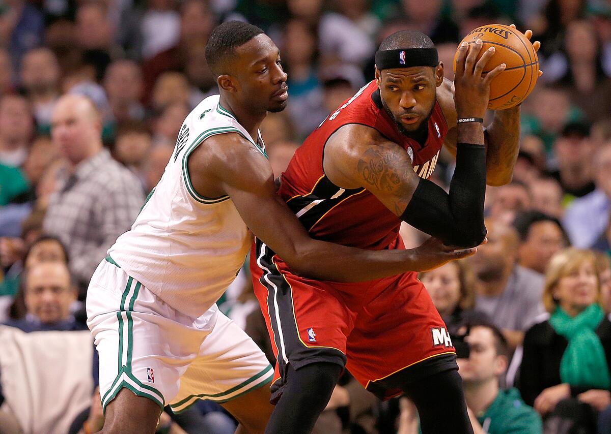 Boston Celtics forward Jeff Green defends Miami Heat forward LeBron James during the fourth quarter of a game on March 18, 2013 in Boston.