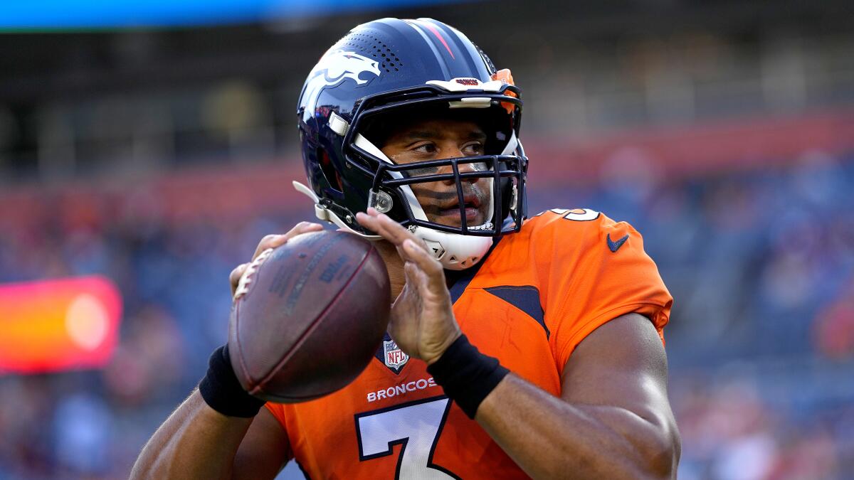 Denver Broncos quarterback Russell Wilson warms up prior a preseason game.