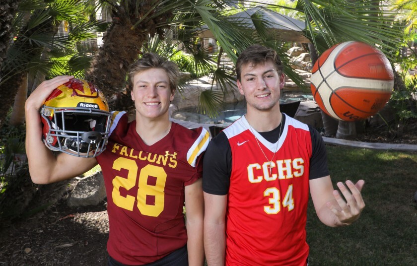 Marco Notarainni (28) plays football for Torrey Pines. Thomas Notarainni (34) plays basketball for Cathedral Catholic. With one season nearing its end and the other about to begin, the brothers took time for a portrait in the backyard of their Rancho Santa Fe home.