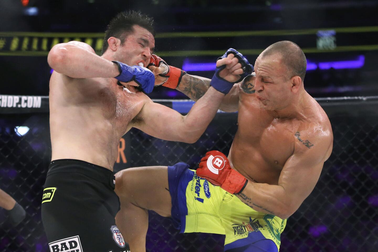 Chael Sonnen, left, trades blows with Wanderlei Silva during their bout at Bellator NYC.