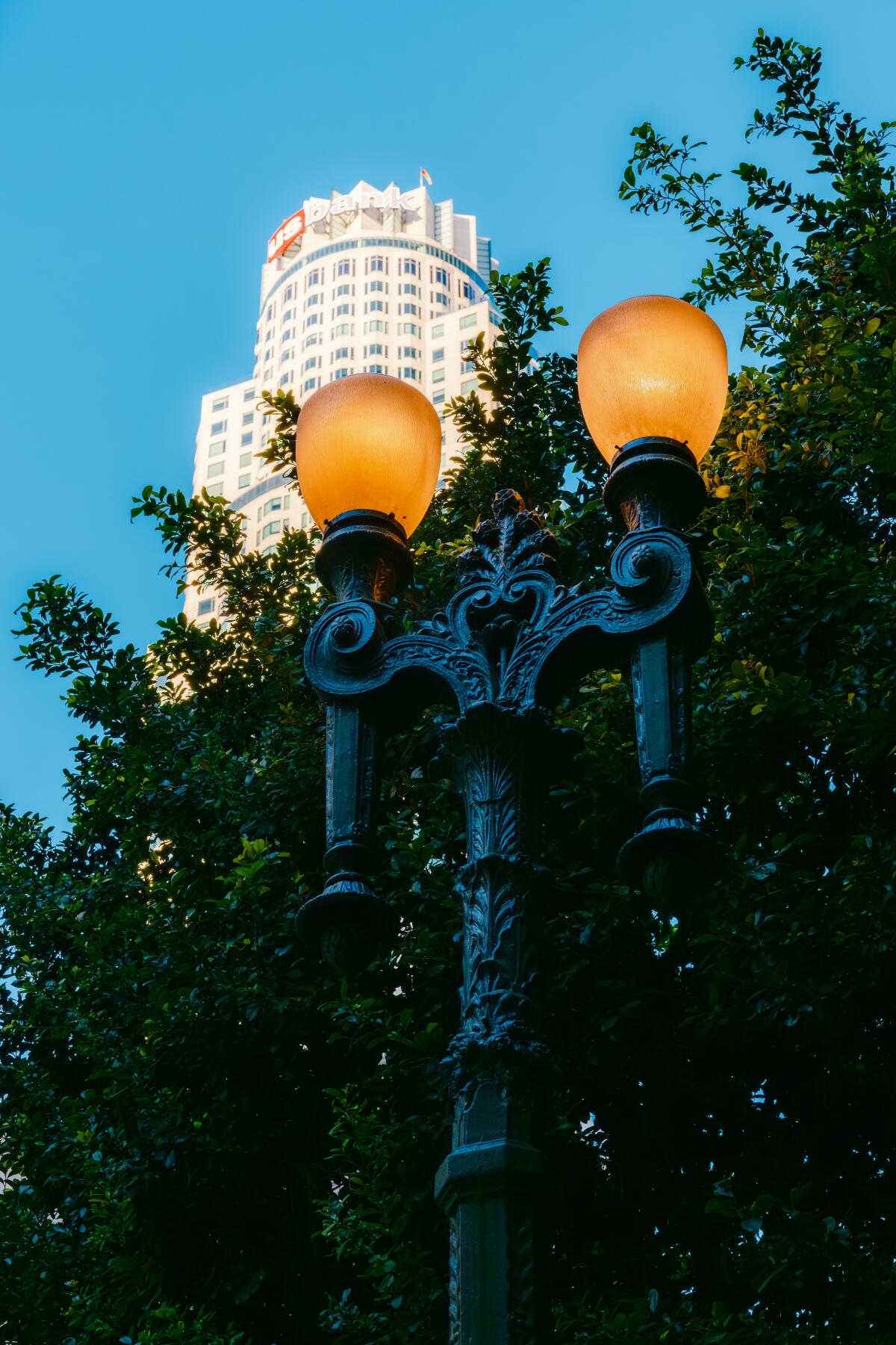 A Broadway Rose streetlight set against the iconic U.S. Bank Tower.