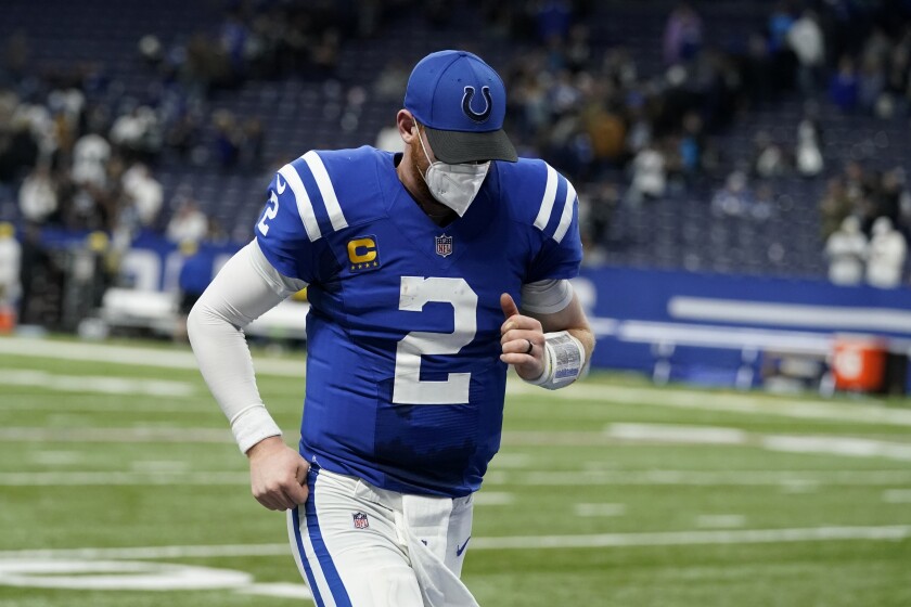 Indianapolis Colts quarterback Carson Wentz (2) runs off the field at the end of an NFL football game against the Las Vegas Raiders, Sunday, Jan. 2, 2022, in Indianapolis. The Raiders won 23-20. (AP Photo/Darron Cummings)