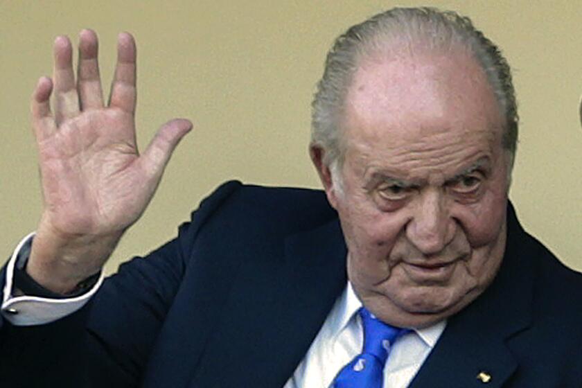 FILE - In this file photo dated Sunday, June 2, 2019, Spain's former King Juan Carlos waves at the bullring in Aranjuez, Spain. The royal family’s website on Monday Aug. 3, 2020, published a letter from Spain’s former monarch, King Juan Carlos I, saying he is leaving Spain to live in another country, amidst a financial scandal. (AP Photo/Andrea Comas, FILE)