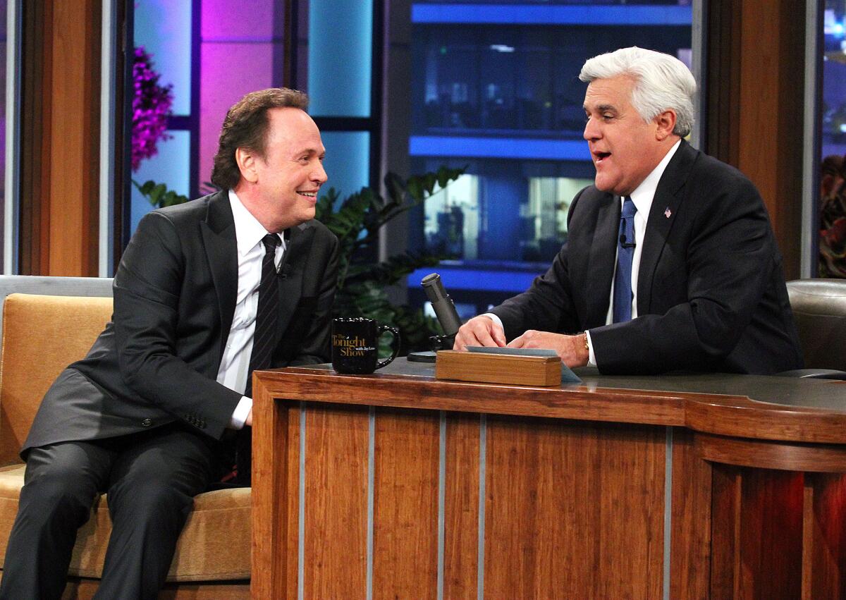 Frequent guest Billy Crystal and Jay Leno talk during a commercial break at the final recording of the Tonight Show with Jay Leno in Burbank at Burbank Studios on Thursday, February 6, 2014. Jay Leno ended a 22 year run as the host of the Tonight Show which now will be hosted by Jimmy Fallon.
