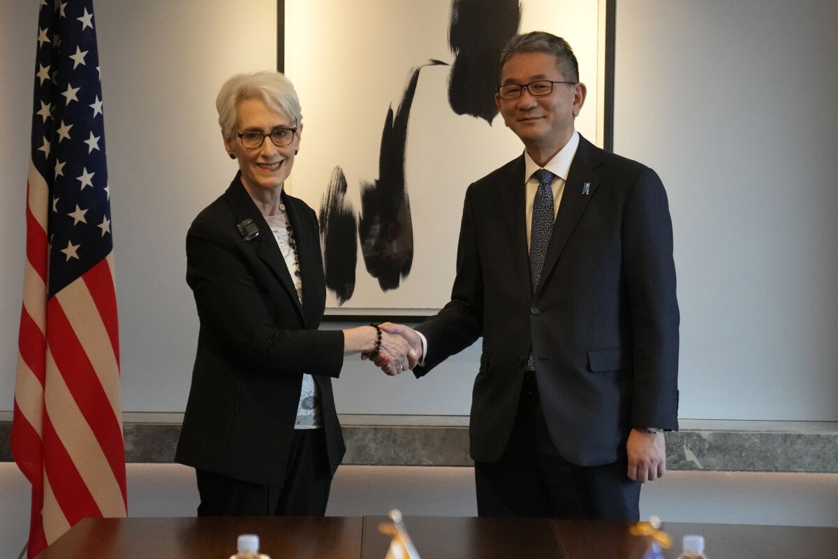 U.S. Deputy Secretary of State Wendy Sherman, left, and Japanese Vice Minister for Foreign Affairs Takeo Mori, right, shake hands for the media before their meeting in Seoul, South Korea, Wednesday, June 8, 2022. U.S. Deputy Secretary of State Wendy Sherman met with her counterparts from South Korea and Japan on Wednesday, emphasizing the U.S. commitment to defend its allies and trilateral security cooperation to confront an accelerating nuclear threat from North Korea. (AP Photo/Lee Jin-man)