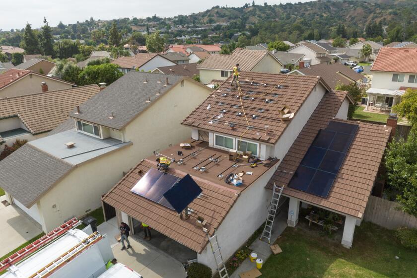 BREA, CA - JUNE 15: A house in Brea, CA gets solar panels installed on Thursday, June 15, 2023. (Myung J. Chun / Los Angeles Times)