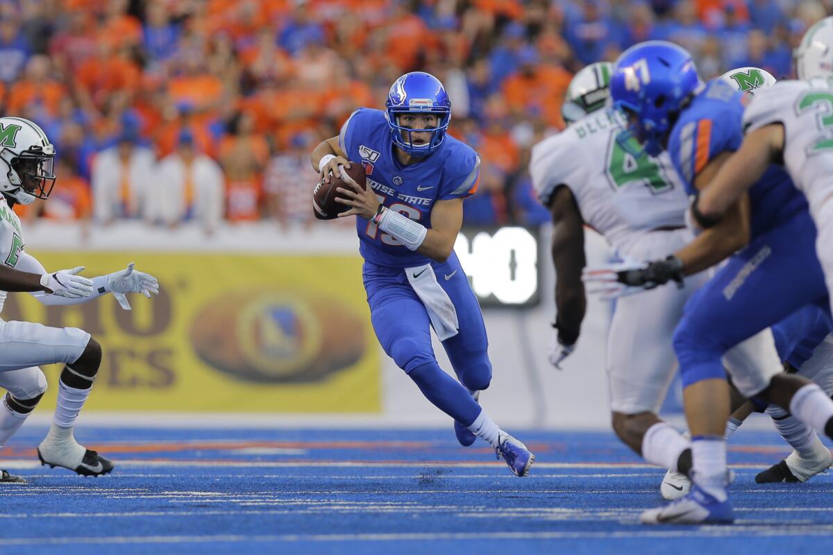 Boise State quarterback Hank Bachmeier (19) runs the ball during the first half against Marshall in Boise, Idaho on Friday.