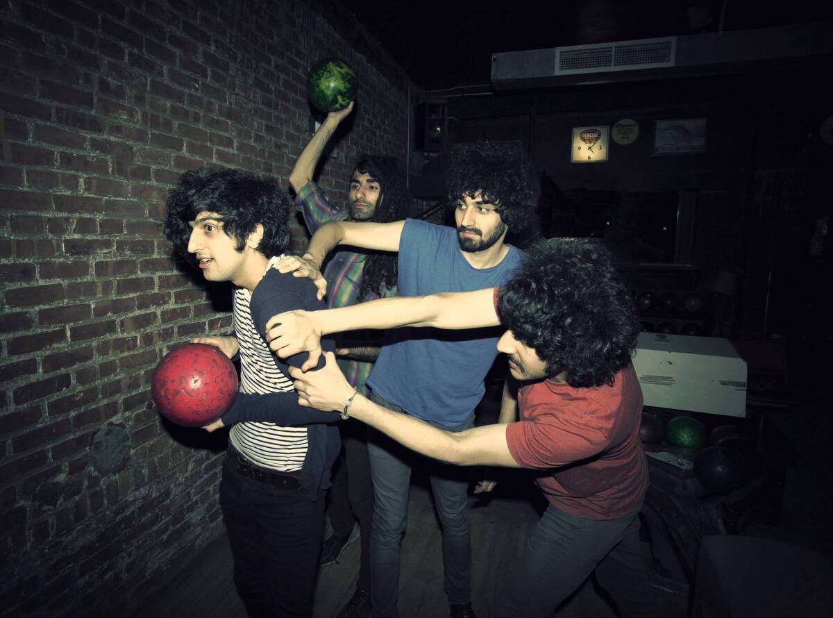 Yellow Dogs members Koroush Mirzaei, left, Siavash Karampour, Arash Farazmand and Sourosh Farazmand at a bowling alley in Brooklyn. The Farazmand brothers were two of four musicians found dead in an apparent murder-suicide.