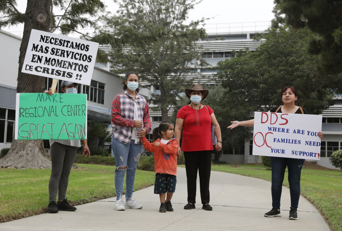 Families protest at the Regional Center of Orange County in September.