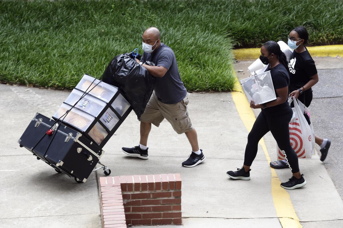 Students move in for fall semester at North Carolina State University in Raleigh.