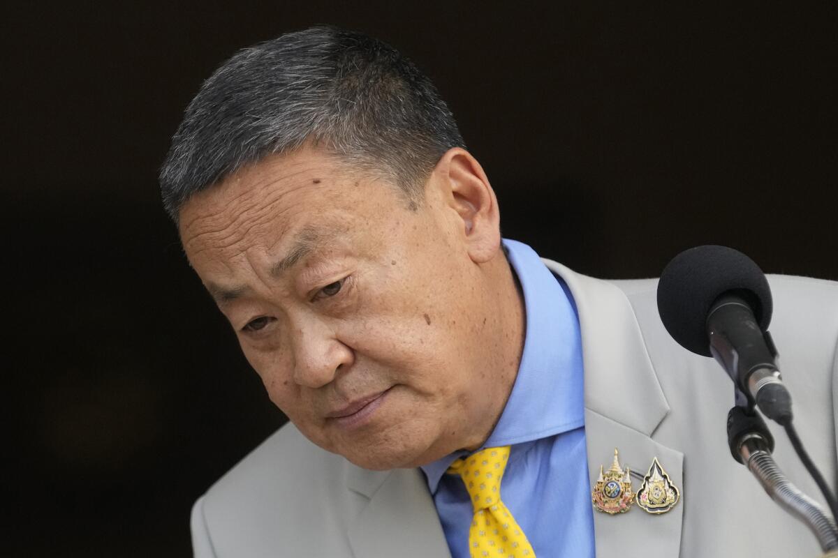 Thai Prime Minister Srettha Thavisin listens to a question from a reporter during a news conference.