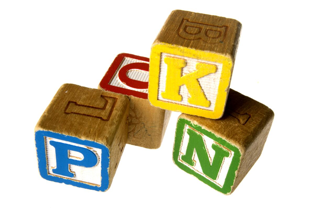 A pile of kids alphabet blocks