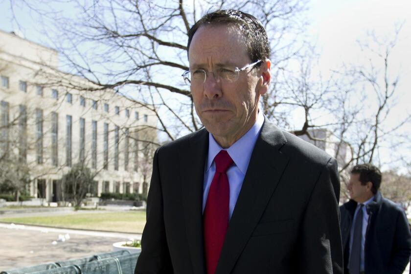 AT&T CEO Randall Stephenson leaves the federal courthouse Thursday, March 22, 2018, in Washington. The Trump administration is facing off against AT&T to block the telephone giant from absorbing Time Warner, in a case that could shape how consumers get, and how much they pay for, streaming TV and movies. (AP Photo/Jose Luis Magana)