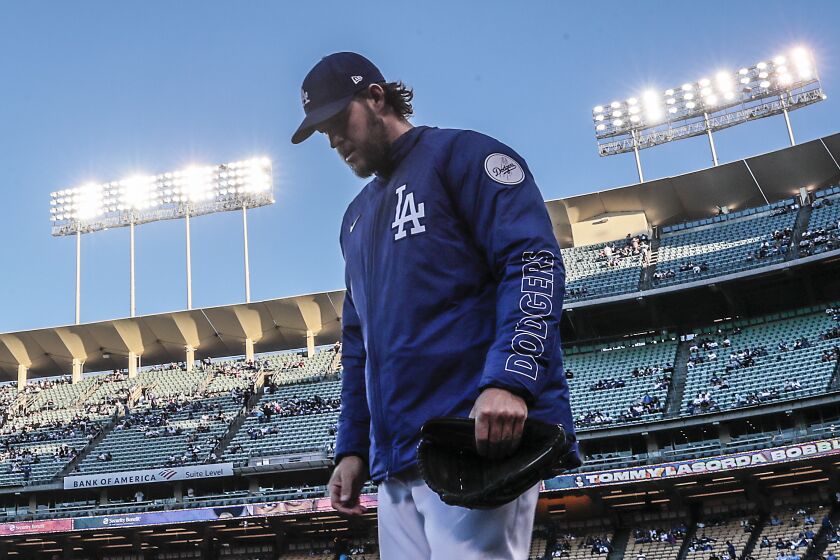 Los Angeles, CA, Monday, Sept. 13, 2021 - Dodgers pitcher Clayton Kershaw heads to the outfield to warm up before starting against the Arizona Diamondbacks at Dodger Stadium. (Robert Gauthier/Los Angeles Times)