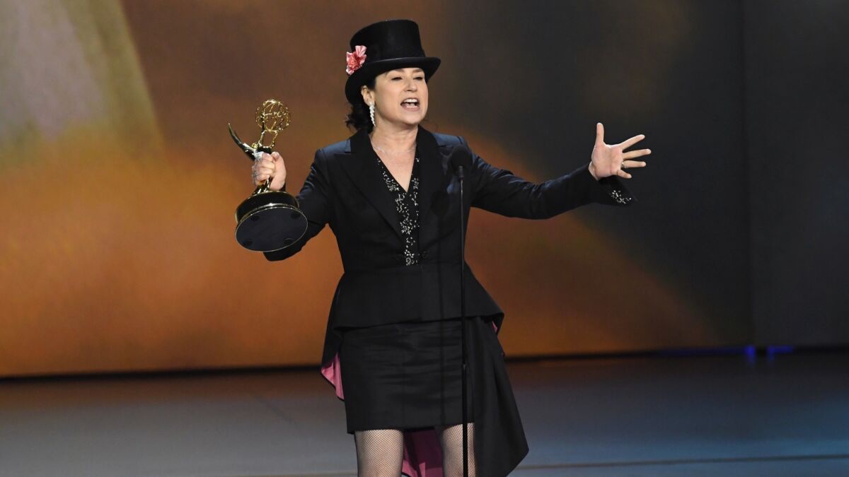 Amy Sherman-Palladino accepts the comedy series writing award for her work on comedy series winner "The Marvelous Mrs. Maisel." She also won for directing and, in an earlier ceremony, music supervision.