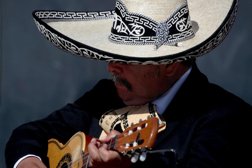 LOS ANGELES, CALIF. - APR. 12, 2022. A member of Maricahi Mariachi Los Dorados De Villa, performs uring a campaign event for Los Angeles mayoral candidate Karen Bass on Tuesday, April 12, 2022. (Luis Sinco / Los Angeles Times)