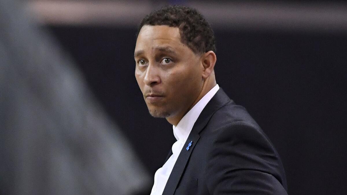 USC assistant coach Tony Bland stands on the court during a game against UCLA in February 2017. Bland is scheduled to be sentenced in June for his alleged role in the college basketball bribery scandal.