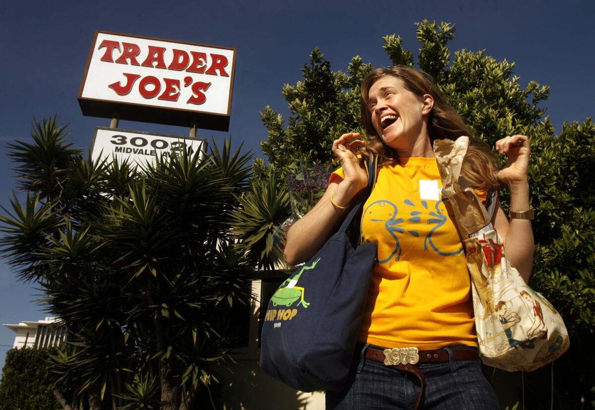 A new YouTube video pokes fun at Trader Joe's fanatics. Pictured is Wendy Bryan in front of the Trader Joe's where she won groceries for using her own bags to carry her groceries.