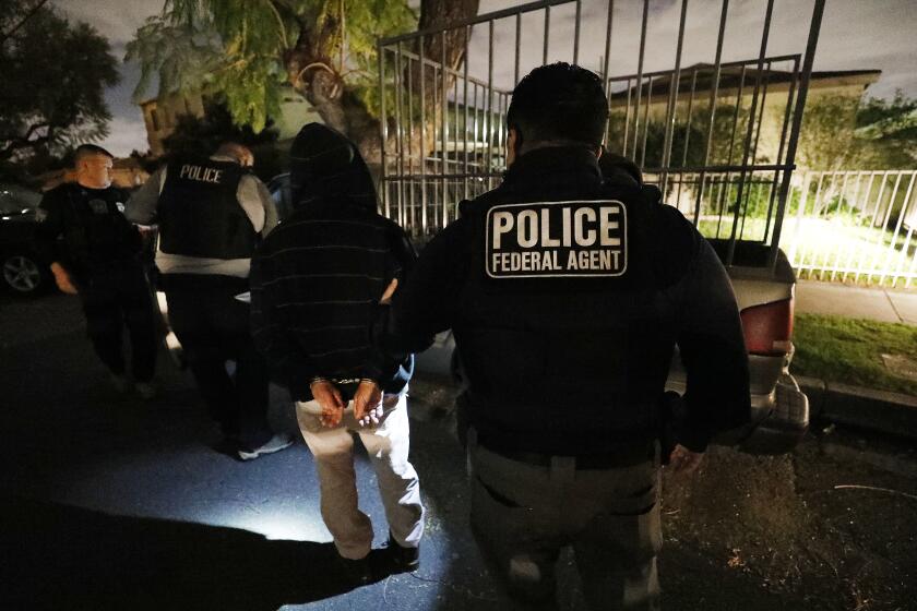 David A. Marin, far left, Field Office Director Enforcement and Removal Operations Los Angeles Field Office of U.S. Immigration and Customs Enforcement (ICE) during a pre-dawn apprehension of Pedro Castillo Bravo as ICE officers are joined by (CBP) U.S. Customs & Border Protection agents in the last few weeks, as more resources are deployed in sanctuary cities.