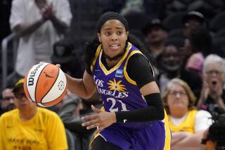 Los Angeles Sparks guard Jordin Canada dribbles during the second half of a WNBA basketball game.