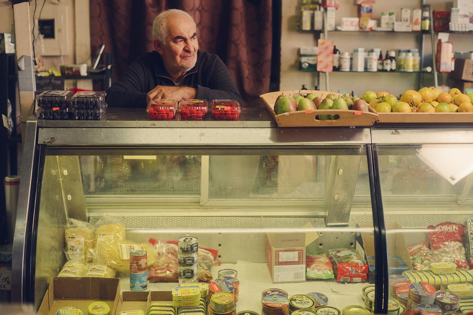 Paul Khostikyan of Cherry Garden behind the deli's food counter