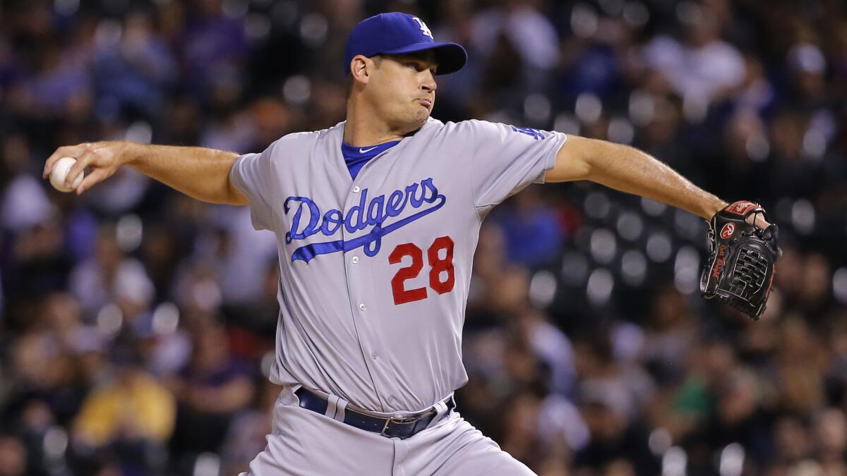 Dodgers reliever Jamey Wright delivers a pitch during the fifth inning of an 11-3 win over the Colorado Rockies on Monday.