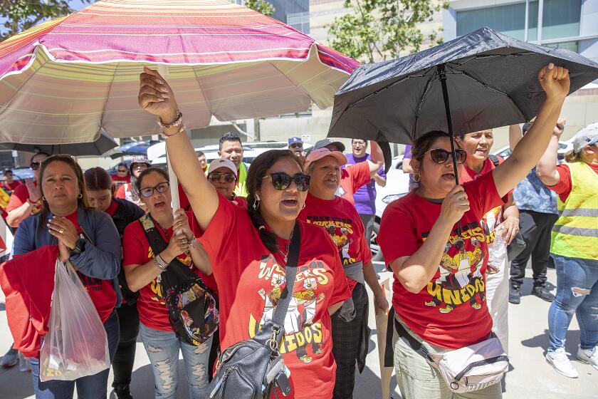 LOS ANGELES, CA-JULY 13, 2023: Fast Food workers from across Los Angeles rally outside of the Los Angeles Chamber of Commerce in Los Angeles. They are rallying to raise awareness of their push for better working conditions. (Mel Melcon / Los Angeles Times)