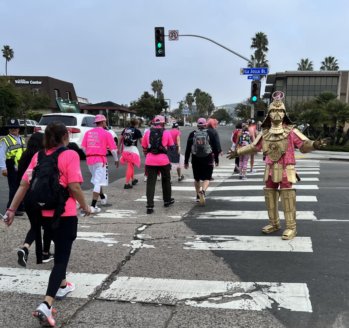 Christopher Canole, as Dude Vader, escorts participants passing through La Jolla in the Susan G. Komen 3-Day walk. 