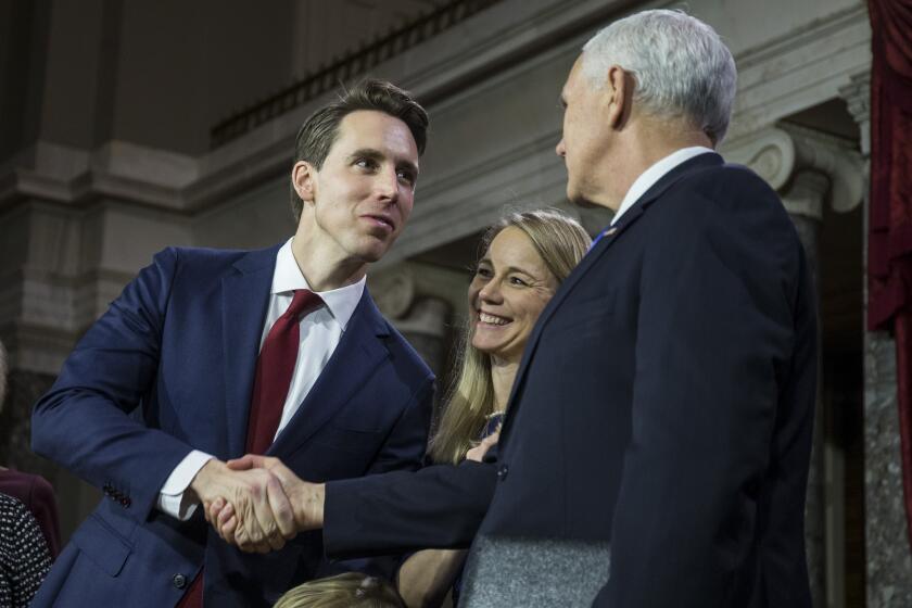 WASHINGTON, DC - JANUARY 03: Senator Josh Hawley (R-MO) participates in a mock swearing in ceremony with Vice President Mike Pence on Capitol Hill on January 3, 2019 in Washington, DC. (Photo by Zach Gibson/Getty Images)