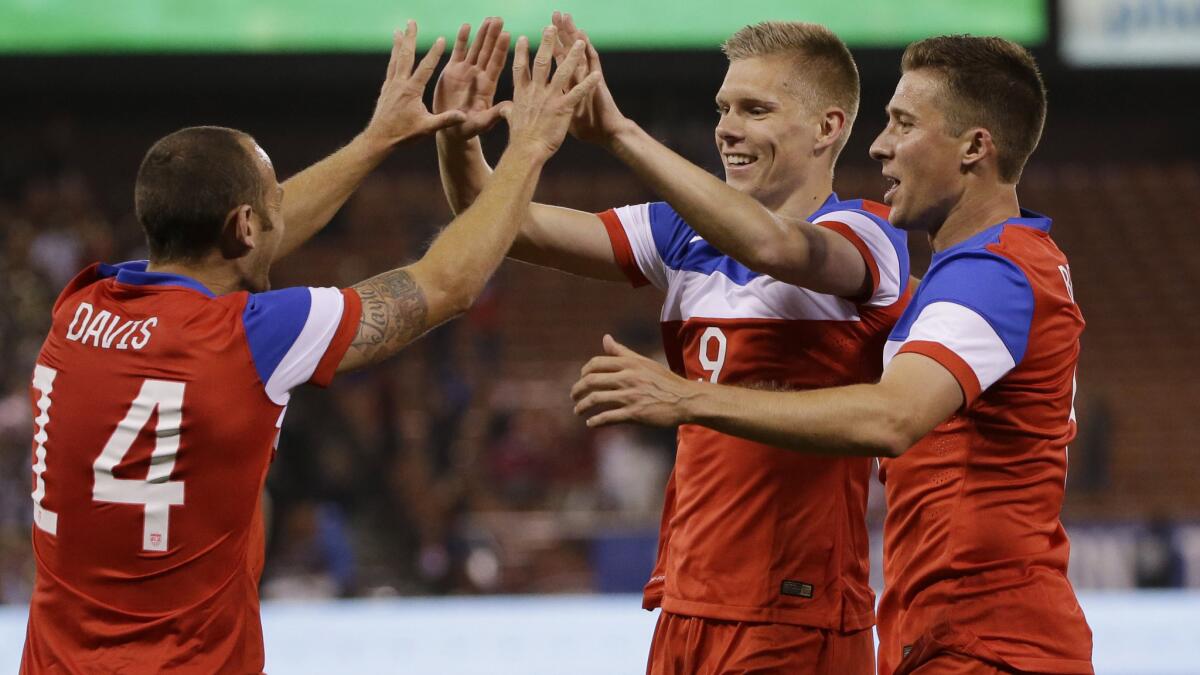 U.S. forward Aron Johannsson, center, celebrates with teammates Brad Davis, left, and Matt Besler after scoring during the second half of a 2-0 victory over Azerbaijan in an international friendly match Tuesday at Candlestick Park in San Francisco.