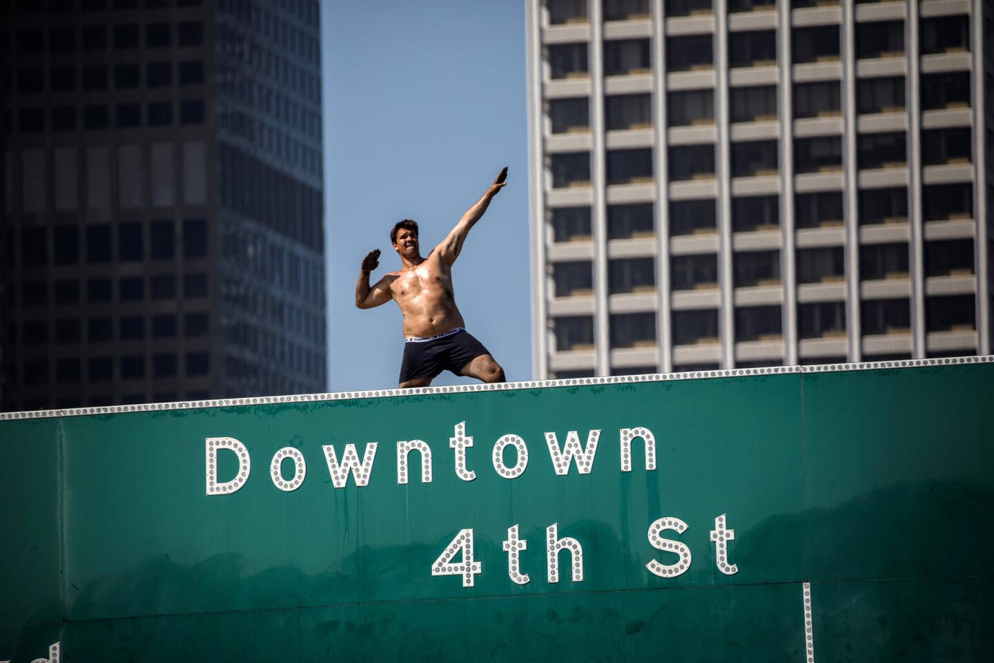 Man scales freeway sign in Los Angeles